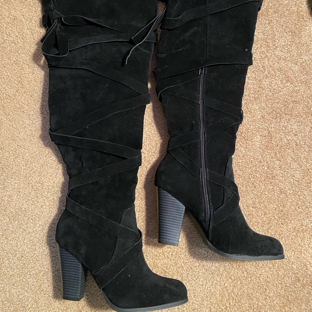 Thigh high heeled boots
